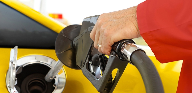 person-filling-fuel-at-fuelstation